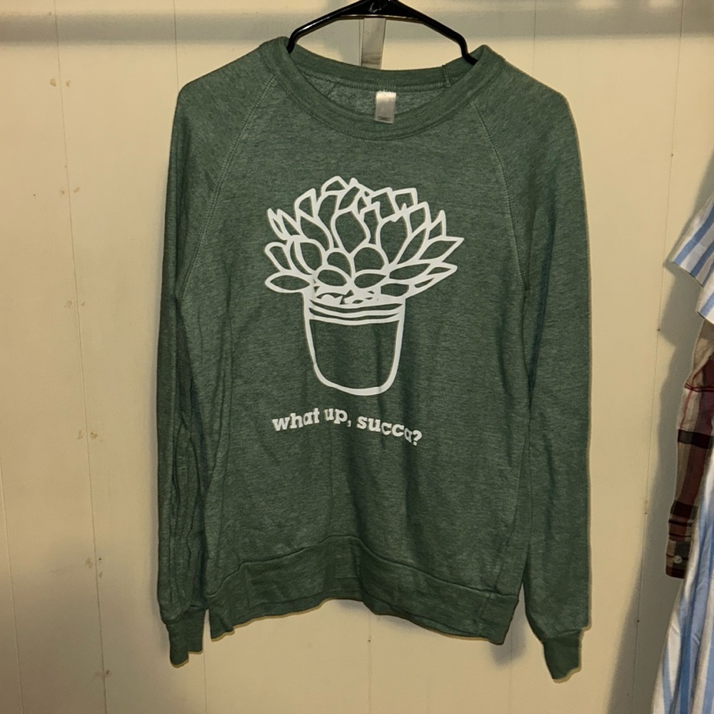 Long sleevee sweater for plant lovers. Size small, green. Brand unknown.